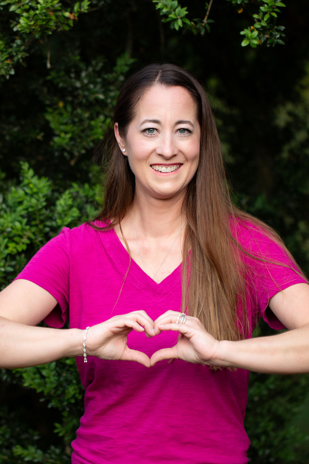 Melissa Miller with heart hands